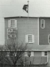<p>People inside the compound lowered a banner outside a window on M<span style="font-size: 1em; background-color: transparent;">arch 14, 1993,</span><span style="font-size: 1em; background-color: transparent;">&nbsp;that read, "FBI Broke Negotiation" We Want Press."</span></p>(The Dallas Morning News/Irwin Thompson)