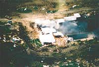 A photo taken from an FBI aircraft just after noon on April 19 as fire first broke out in the compound.(FBI)